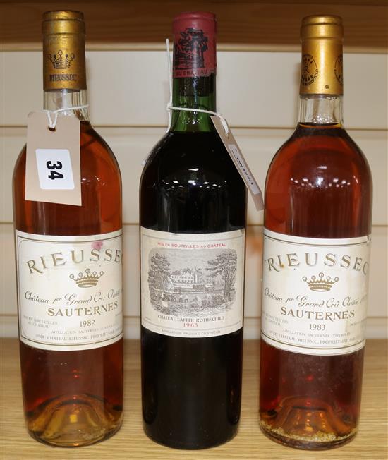 A bottle of Chateau Lafite Rothschild 1965 and and two bottles of Chateau Rieussec Sauternes Premier Cru